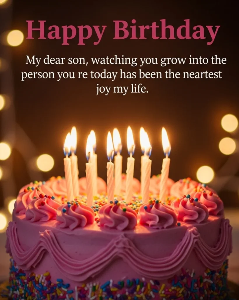 Birthday blessings for son image with a pink frosted birthday cake with lit candles and colorful sprinkles on a warm dark bokeh fairy lights background